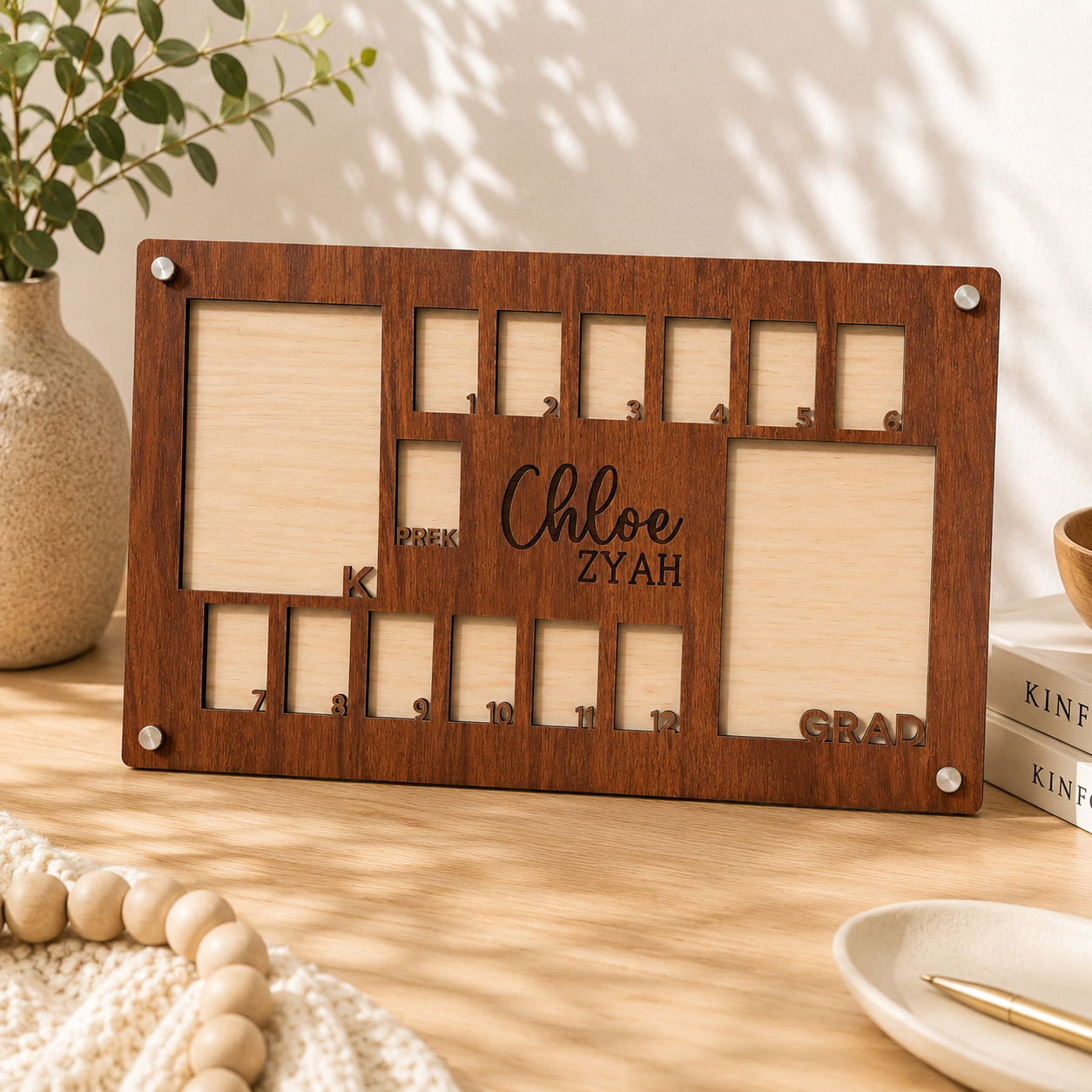 Close-up shot of a blank personalized brown wood K-12 school years growth photo frame featuring a clear protective acrylic top cover held securely with clean silver metal standoffs.