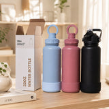 Custom engraved 32oz stainless steel water bottles with magnetic phone holder lids in blue and mauve and flip straw in black