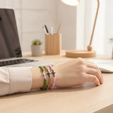 Woman wearing a Braided Cross Bracelet with adjustable cord and cross charm, showcasing a minimalist Christian bracelet for everyday wear and meaningful faith-inspired gifts.