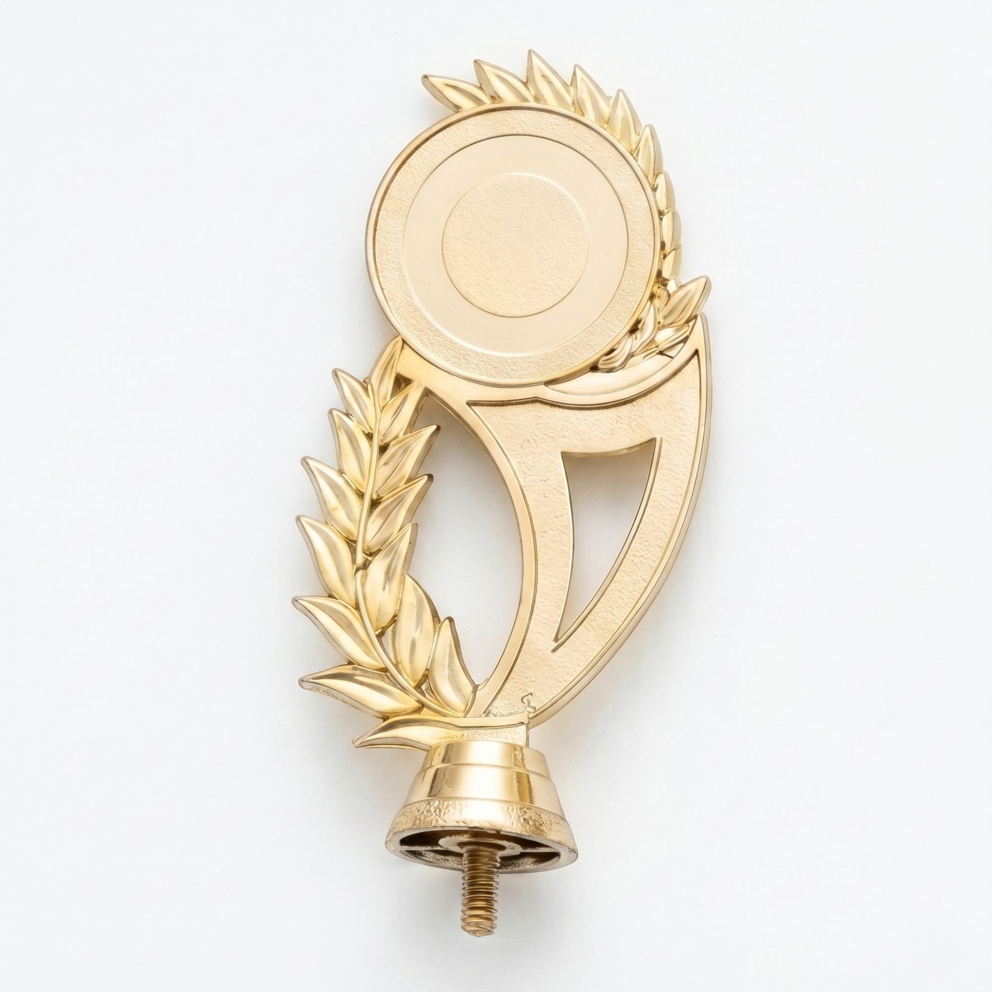 A shiny gold trophy topper insert component featuring a minimalist circular emblem disc framed beautifully by an asymmetric laurel leaf branch design.