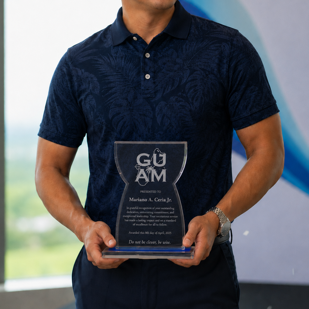 A man in a patterned dark blue polo shirt holding the personalized crystal latte stone achievement award up close, showcasing the clean white laser-etched military appreciation text.