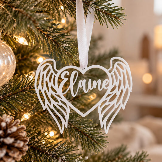 Custom name angel wing Christmas tree ornament, a personalized white heart decoration and meaningful holiday gift.