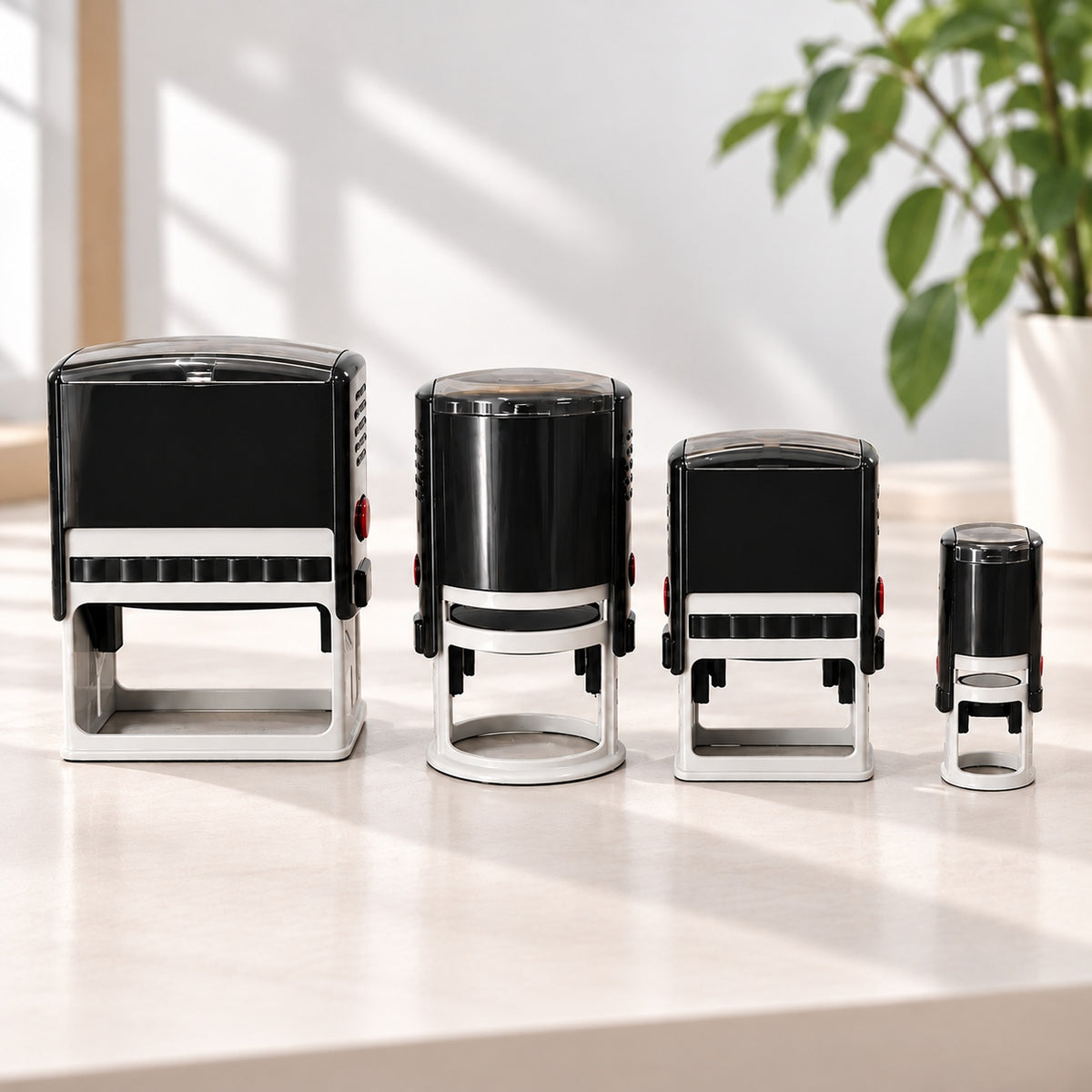Custom self-inking stamps in multiple sizes for personalized business branding, packaging, and everyday office use.