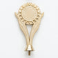 Modern V-shaped gold victory topper with a central sunburst emblem holder.