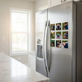 Side perspective view of a premium stainless steel kitchen refrigerator showcasing a grid arrangement of nine custom 2.5 inch square glossy photo magnets featuring family vacation memories.
