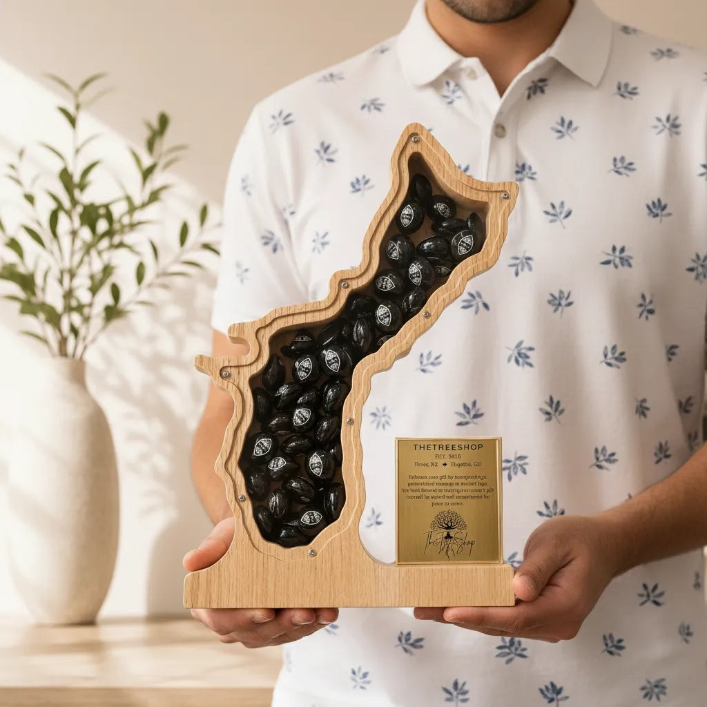 A man in a white patterned polo shirt holding the custom personalized 12-inch wooden Guam Island shadow box recognition award, showcasing the high-contrast engraved gold plate detail.