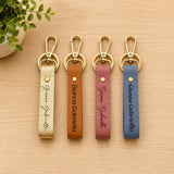 Personalized faux leather keychains with custom engraved names in Champagne, Caramel, Dusty Rose, and Slate Blue featuring gold-tone swivel clasps.